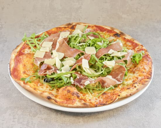 Pizza Fiorentina de La Toscane avec Serrano, roquette, artichaut et parmesan